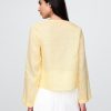 Camicia con nodo frontale in lino 100% Camicia con nodo frontale in lino 100%