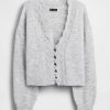 Cardigan corto smerlato traforato e sfocato Cardigan corto smerlato traforato e sfocato