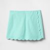 Gonna-pantalone avvolgente smerlata in lino e cotone per bambini Gonna-pantalone avvolgente smerlata in lino e cotone per bambini