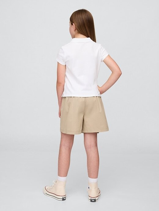 Gonna-pantalone plissettata cachi per bambini, modello uniforme Gonna-pantalone plissettata cachi per bambini, modello uniforme