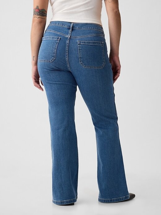 Jeans a zampa anni ’70 a vita alta Jeans a zampa anni ’70 a vita alta