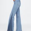 Jeans a zampa anni ’70 con toppe a vita alta Jeans a zampa anni ’70 con toppe a vita alta