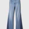 Jeans a zampa anni ’70 con toppe a vita alta Jeans a zampa anni ’70 con toppe a vita alta