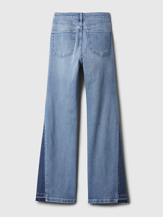 Jeans a zampa anni ’70 con toppe a vita alta Jeans a zampa anni ’70 con toppe a vita alta