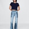 Jeans a zampa patchwork anni ’70 a vita alta
