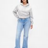 Jeans lunghi e attillati a vita bassa e sinuosa Jeans lunghi e attillati a vita bassa e sinuosa