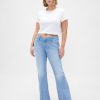 Jeans lunghi e attillati a vita bassa e sinuosa Jeans lunghi e attillati a vita bassa e sinuosa