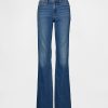 Jeans lunghi e attillati a vita bassa e sinuosa Jeans lunghi e attillati a vita bassa e sinuosa