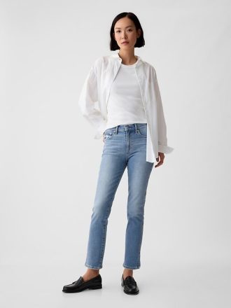 Jeans slim vintage a vita media con orlo diviso
