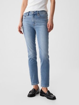 Jeans slim vintage a vita media con orlo diviso