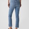 Jeans slim vintage a vita media con orlo diviso Jeans slim vintage a vita media con orlo diviso