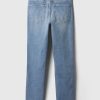 Jeans slim vintage a vita media con orlo diviso Jeans slim vintage a vita media con orlo diviso