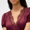 Mini abito con scollo a V e pizzo satinato