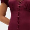 Mini abito con scollo a V e pizzo satinato