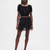 Mini gonna-pantalone con volant e occhielli Mini gonna-pantalone con volant e occhielli
