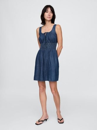 Miniabito in denim con vita arricciata e nodo sul davanti
