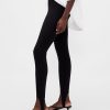 Pantaloni a vita alta con doppia staffa in maglia Pantaloni a vita alta con doppia staffa in maglia