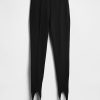 Pantaloni a vita alta con doppia staffa in maglia Pantaloni a vita alta con doppia staffa in maglia