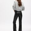 Pantaloni a zampa in pelle vegana a vita alta anni ’70