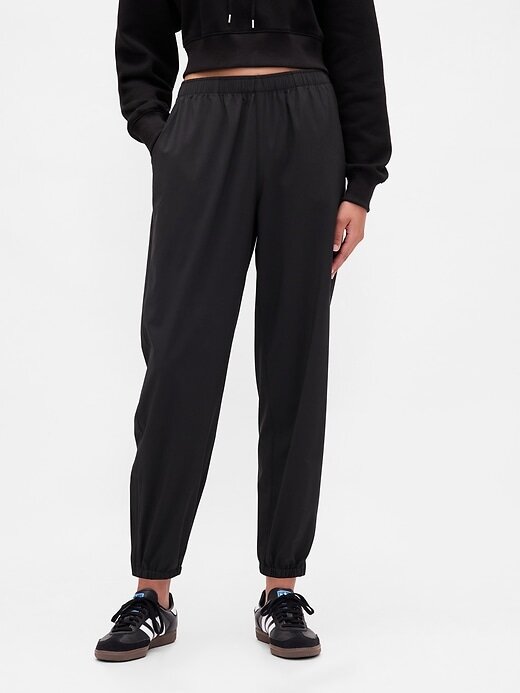 Pantaloni da jogging GapFit Tech a vita alta con cerniera e orlo Pantaloni da jogging GapFit Tech a vita alta con cerniera e orlo
