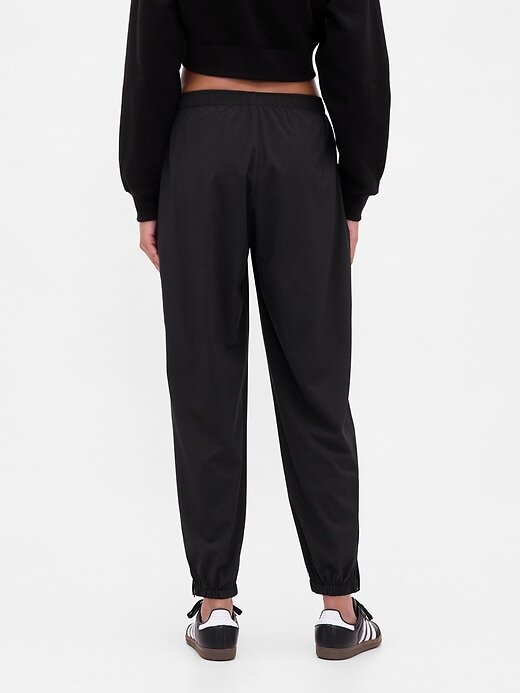 Pantaloni da jogging GapFit Tech a vita alta con cerniera e orlo Pantaloni da jogging GapFit Tech a vita alta con cerniera e orlo