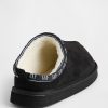 Pantofole per bambini in pelle scamosciata vegana con logo e fodera in sherpa Pantofole per bambini in pelle scamosciata vegana con logo e fodera in sherpa