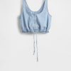 Top corto in denim con orlo stretto Top corto in denim con orlo stretto