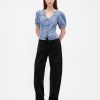 Top in denim con maniche a sbuffo e cuciture Top in denim con maniche a sbuffo e cuciture