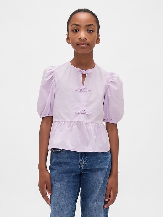 Top peplo con maniche a sbuffo per bambini Top peplo con maniche a sbuffo per bambini