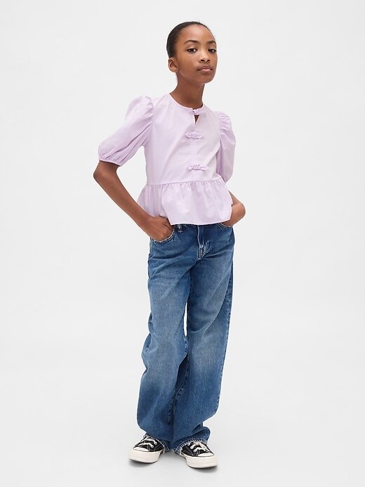 Top peplo con maniche a sbuffo per bambini Top peplo con maniche a sbuffo per bambini