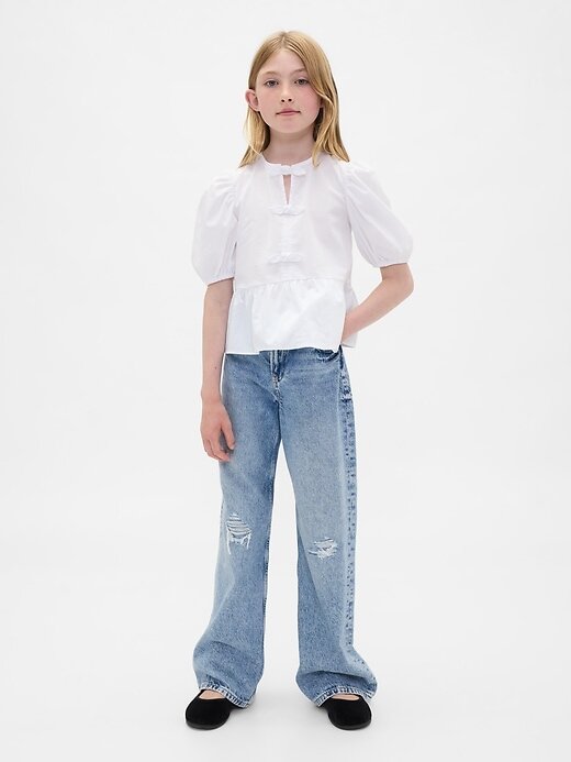 Top peplo con maniche a sbuffo per bambini Top peplo con maniche a sbuffo per bambini