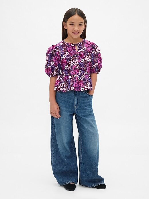 Top peplo con maniche a sbuffo per bambini Top peplo con maniche a sbuffo per bambini