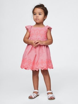 Vestito con occhielli per neonati e bambini