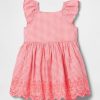 Vestito con occhielli per neonati e bambini